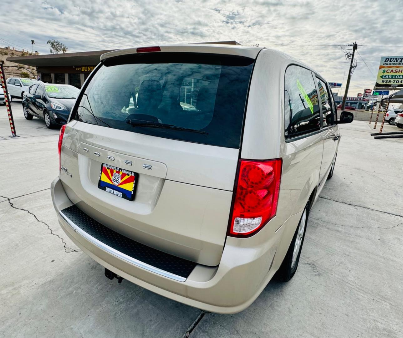 2016 gold Dodge Grand Caravan (2C4RDGBG3GR) , located at 2190 Hwy 95, Bullhead City, AZ, 86442, (928) 704-0060, 0.000000, 0.000000 - 2016 Dodge Grand Caravan SE. *1 owner. Only 52k original miles. Super clean. elderly owned. Brand new tires. Completely serviced. Free Warranty. Free carfax. - Photo#4